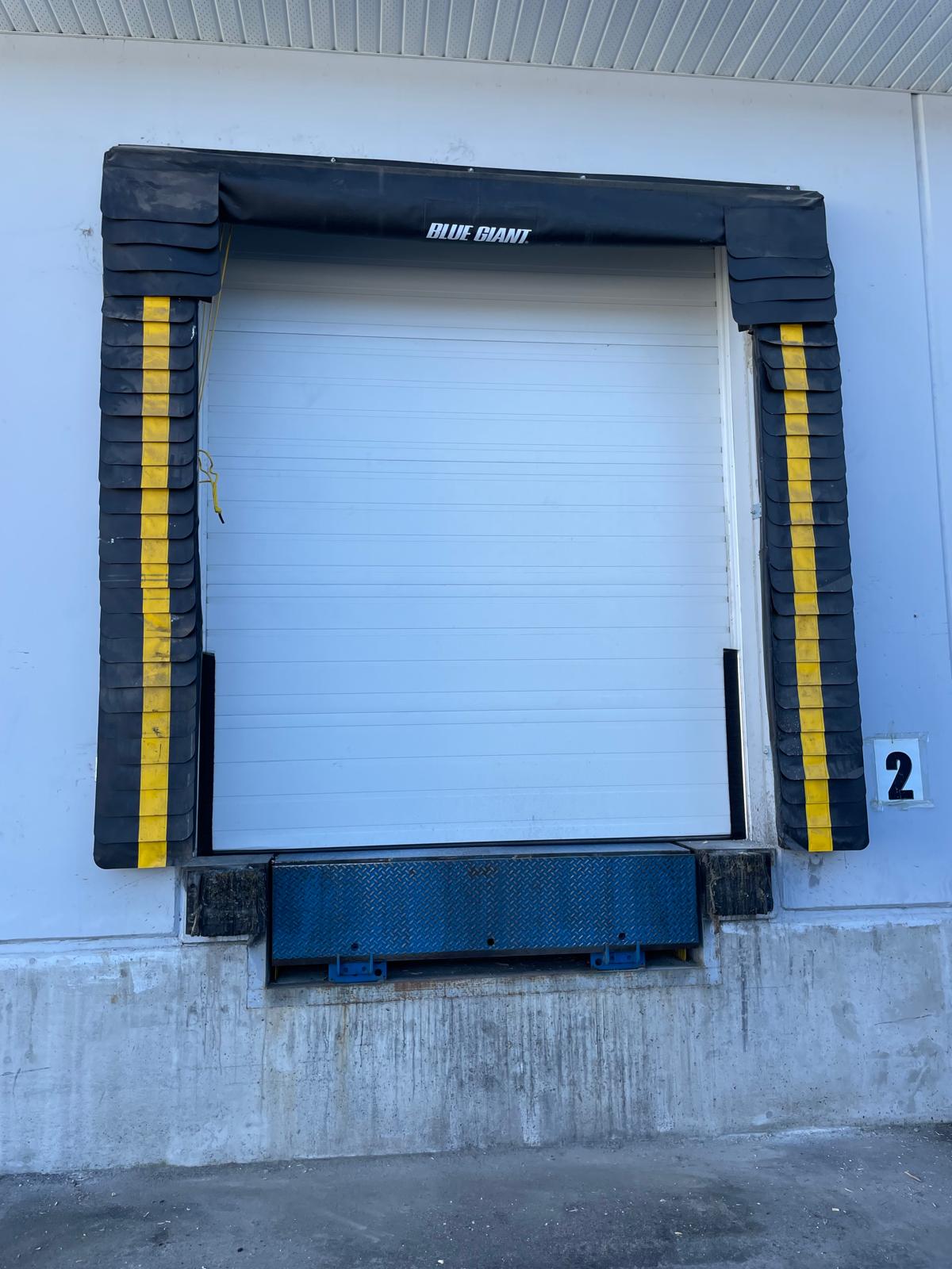 Overhead garage door with dock seals